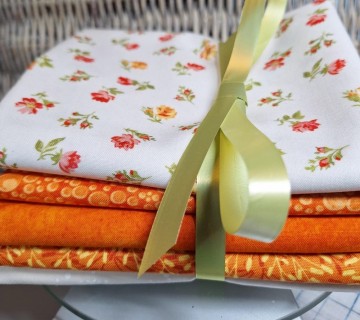 Orange små blomster i en pakke