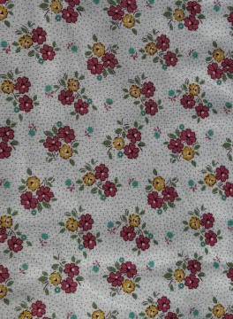 Lys bunn med rosa og gule blomster